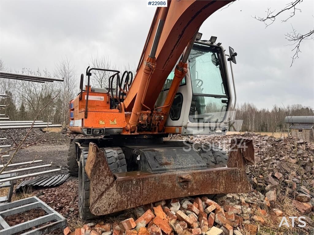 ⇒ Fiat-Hitachi 150W.3 wheeled excavator with rototilt and grading