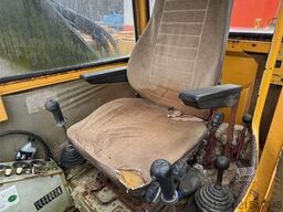 Åkerman H10B crawler excavator with digging bucket.