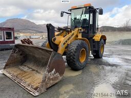 New Holland W130B wheel loader with a bucket