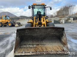 New Holland W130B wheel loader with a bucket