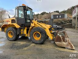 New Holland W130B wheel loader with a bucket