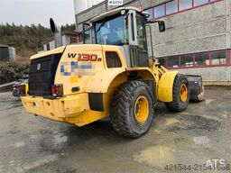 New Holland W130B wheel loader with a bucket