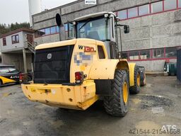 New Holland W130B wheel loader with a bucket