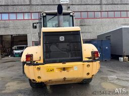 New Holland W130B wheel loader with a bucket