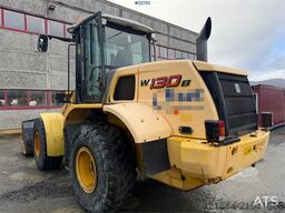 New Holland W130B wheel loader with a bucket