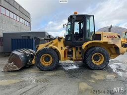 New Holland W130B wheel loader with a bucket