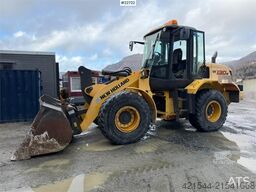 New Holland W130B wheel loader with a bucket