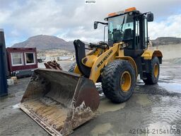 New Holland W130B wheel loader with a bucket