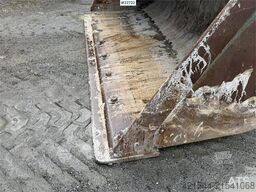 New Holland W130B wheel loader with a bucket