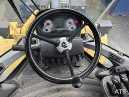 New Holland W130B wheel loader with a bucket
