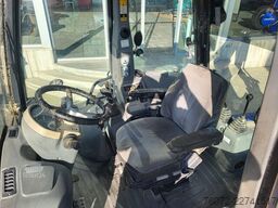 Komatsu WB93R-5. Mixta.