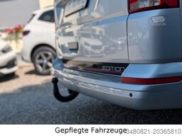 VOLKSWAGEN T6.1 9-Sitzer Kombi *AUTOMATIK* *LANG!* AHK NAVI