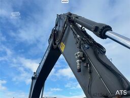 Volvo EC300EL crawler excavator w/ rototilt, cleaning an