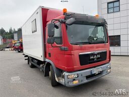 MAN TGL 8.220 4x2 box truck with a 2-ton lift