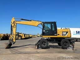 Caterpillar M313D VA - Outriggers + Blade