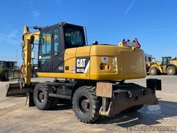 Caterpillar M313D VA - Outriggers + Blade
