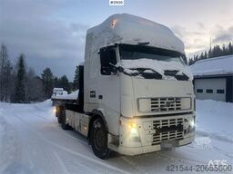 Volvo FH12 snow-plow equipped hook truck with Danish cab