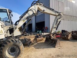 Terex TW110 with two-piece offset boom and 3 buckets