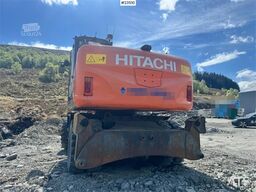 Hitachi ZX140W-3 wheel excavator with Rototilt and grading