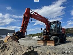Hitachi ZX140W-3 wheel excavator with Rototilt and grading
