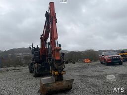 Hitachi zx145W wheeled machine w/ rototilt w/grab box, san