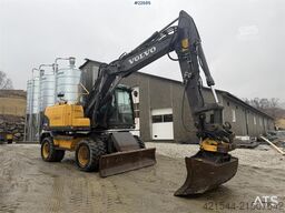 Volvo EW140C wheeled machine w/rototilt, sanding bucket