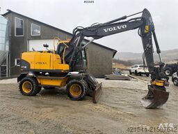 Volvo EW140C wheeled machine w/rototilt, sanding bucket