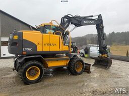 Volvo EW140C wheeled machine w/rototilt, sanding bucket