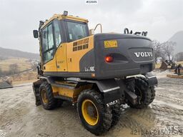 Volvo EW140C wheeled machine w/rototilt, sanding bucket