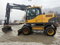 Volvo EW140C wheeled machine w/rototilt, sanding bucket