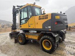 Volvo EW140C wheeled machine w/rototilt, sanding bucket