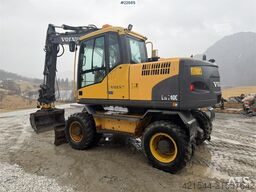 Volvo EW140C wheeled machine w/rototilt, sanding bucket