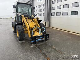 Caterpillar 908M wheel loader with pallet forks and bucket