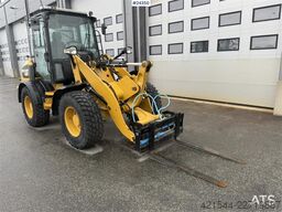 Caterpillar 908M wheel loader with pallet forks and bucket