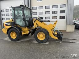 Caterpillar 908M wheel loader with pallet forks and bucket