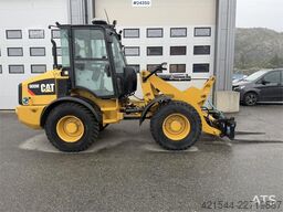 Caterpillar 908M wheel loader with pallet forks and bucket