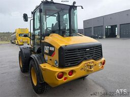 Caterpillar 908M wheel loader with pallet forks and bucket