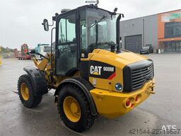 Caterpillar 908M wheel loader with pallet forks and bucket