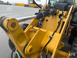 Caterpillar 908M wheel loader with pallet forks and bucket