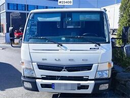 Mitsubishi Fuso Canter 4x2 flatbed truck for sale as a repair