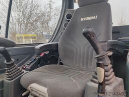 Hyundai R55W-9A with 3 excavator buckets