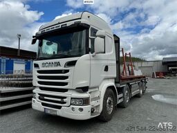 Scania R580 8x2 flatbed truck