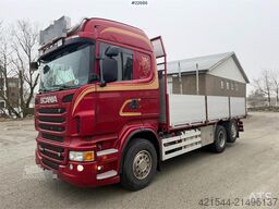 Scania R560 6x2 flatbed truck with setup for a rear-mount