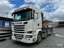 Scania R580 8x2 flatbed truck