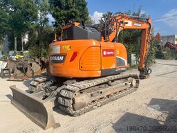 Doosan DX140LCR-5 with PowerTilt OQ65 quickcoupler (without bucket)