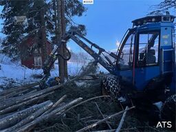 Rottne H8E harvester with harvesting unit and chains.