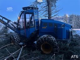 Rottne H8E harvester with harvesting unit and chains.