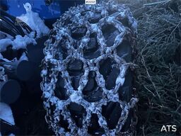 Rottne H8E harvester with harvesting unit and chains.