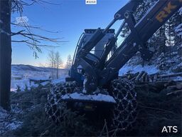 Rottne H8E harvester with harvesting unit and chains.