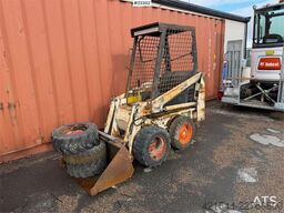Bobcat 34.3 skid steer loader w/ extra tires and bucket.